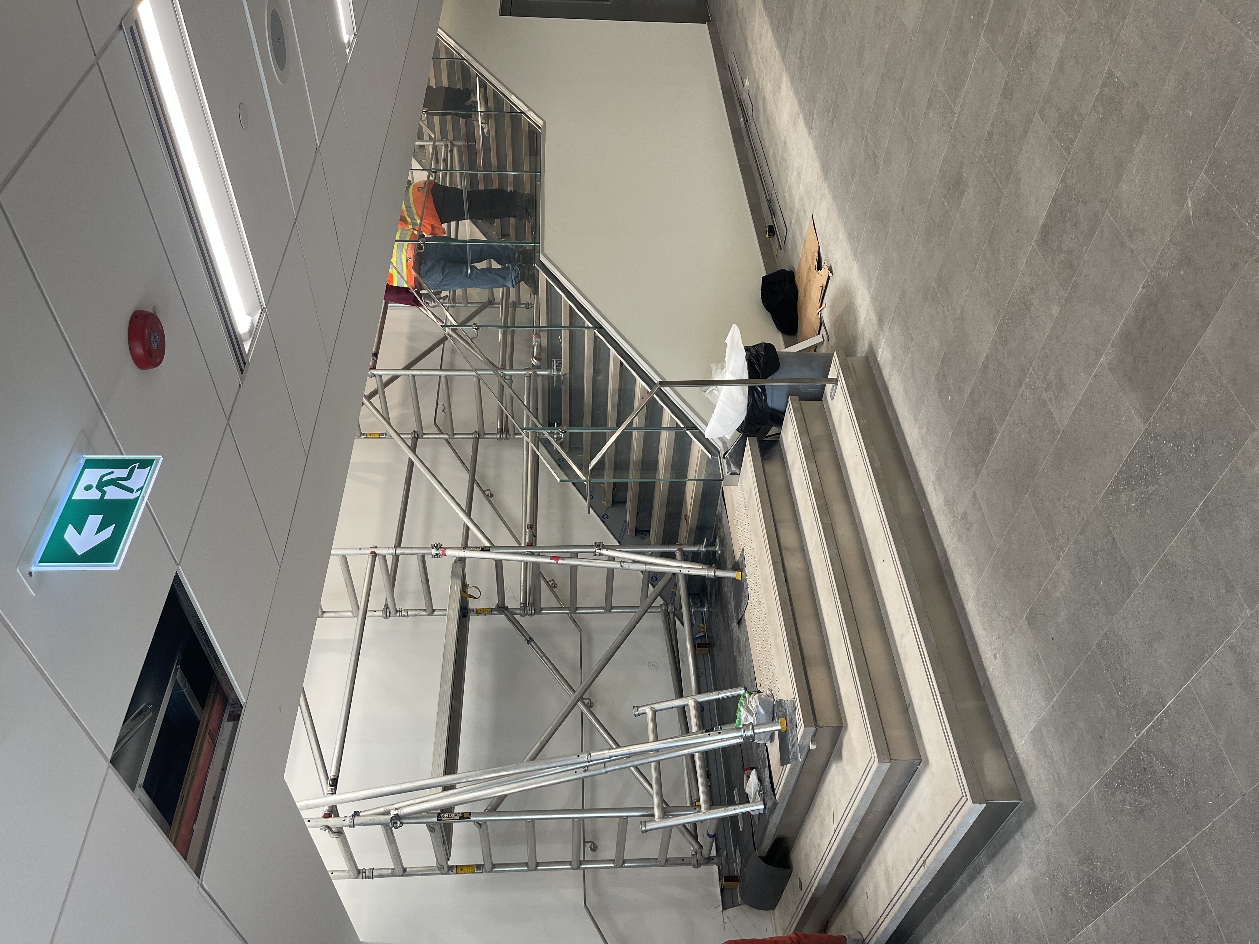 Custers scaffold installed alongside a commercial staircase