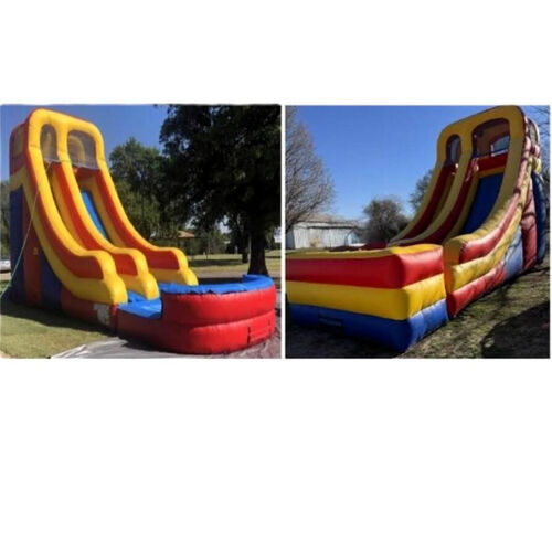 Colorful inflatable bounce slide on a grassy yard beside a brick house under a cloudy sky
