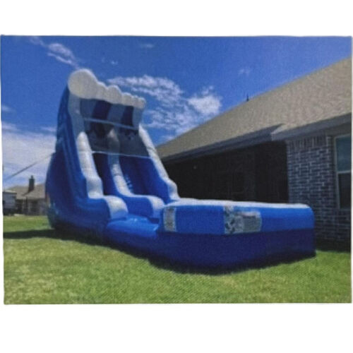 Colorful inflatable bounce slide on a grassy yard beside a brick house under a cloudy sky